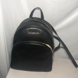 Michael Kors small backpack.